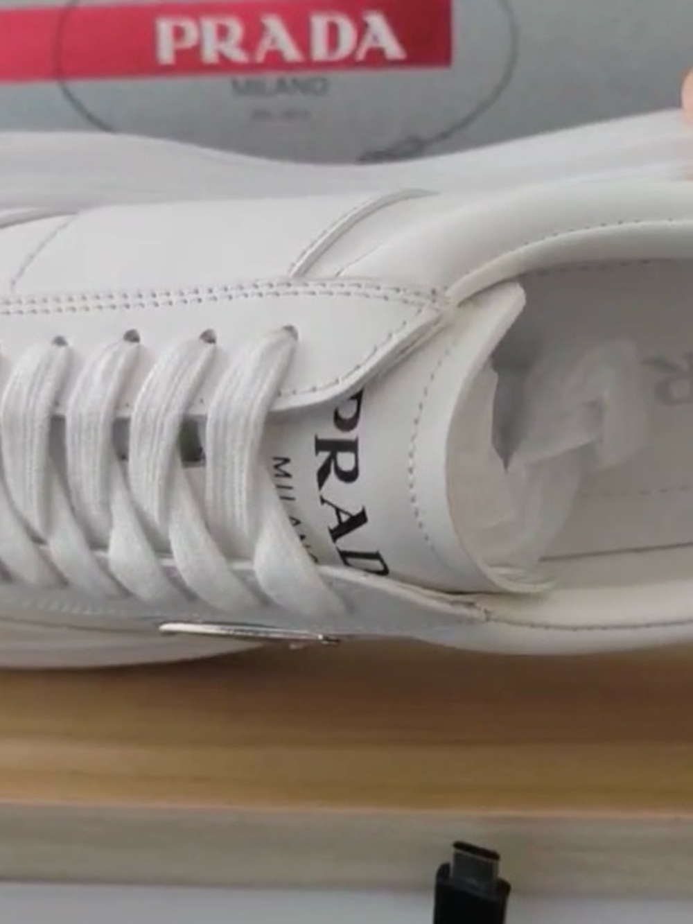 Prada White Leather Low-Top Sneaker with Black Logo - Picture 2 of 4